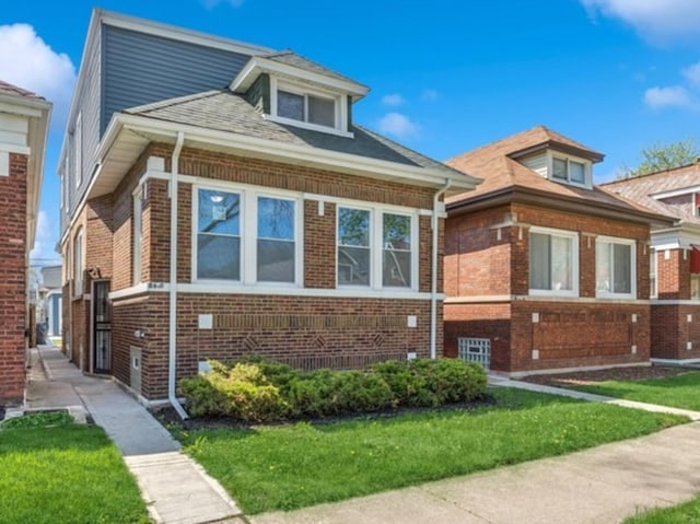 8610 S Aberdeen St, Chicago, IL 60620 - bungalow with brick siding and a front yard