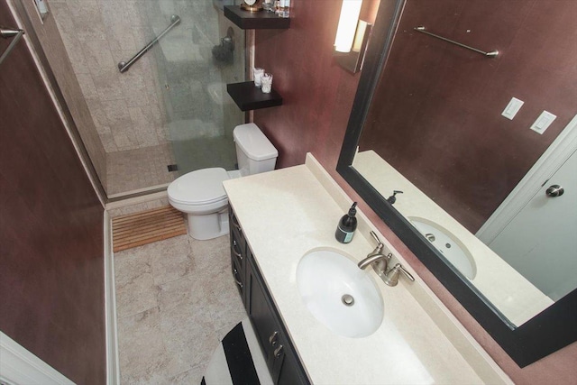 full bath featuring a shower stall, toilet, and vanity