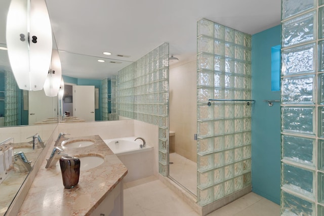 1805 N Paulina St, Chicago, IL 60622 - full bath with a stall shower, a bath, double vanity, tile patterned flooring, and tile walls