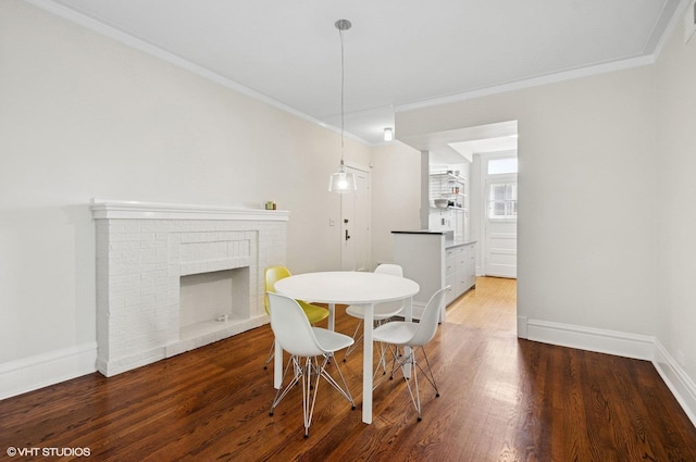 731 W Buckingham Pl Unit 12, Chicago, IL 60657 - dining area with ornamental molding, wood finished floors, baseboards, and a brick fireplace