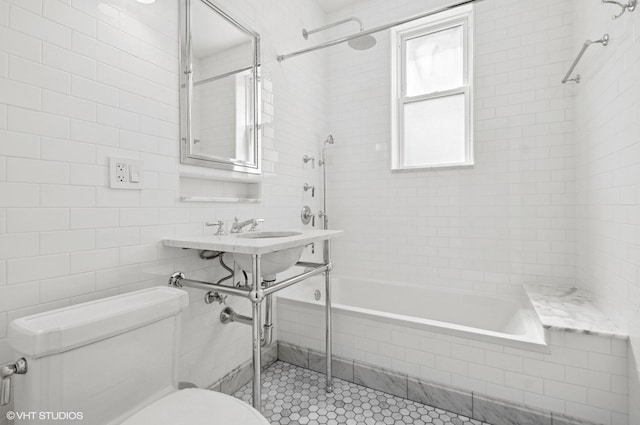 731 W Buckingham Pl Unit 12, Chicago, IL 60657 - bathroom with toilet, tile walls, tiled shower / bath, and tile patterned flooring