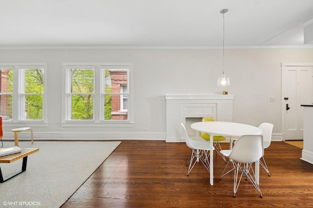 731 W Buckingham Pl Unit 12, Chicago, IL 60657 - dining room featuring ornamental molding, baseboards, and wood finished floors
