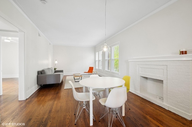 731 W Buckingham Pl Unit 12, Chicago, IL 60657 - dining room featuring ornamental molding, dark wood-style flooring, baseboards, and a brick fireplace