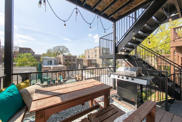 balcony with stairs, grilling area, and outdoor lounge area