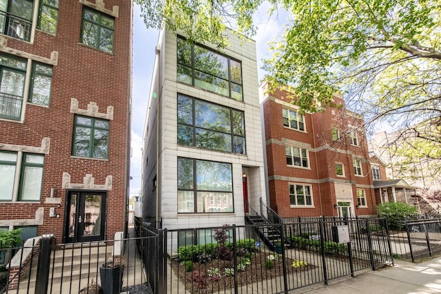 view of building exterior with a fenced front yard