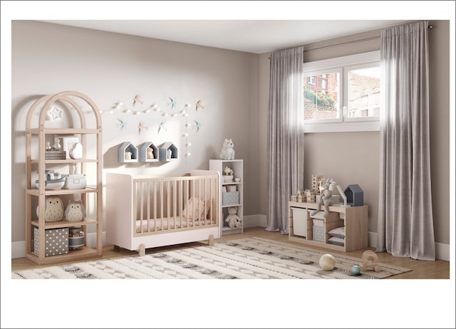 2659 W Medill Ave, Chicago, IL 60647 - bedroom with a nursery area and wood finished floors