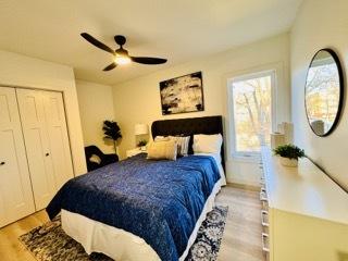 619 N Homan Ave, Chicago, IL 60624 - bedroom with light wood-type flooring, a ceiling fan, and a closet