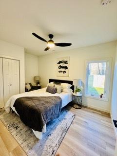 619 N Homan Ave, Chicago, IL 60624 - bedroom featuring wood finished floors, ceiling fan, a closet, and baseboards