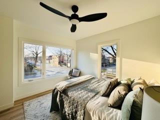 619 N Homan Ave, Chicago, IL 60624 - bedroom with wood finished floors, baseboards, and ceiling fan