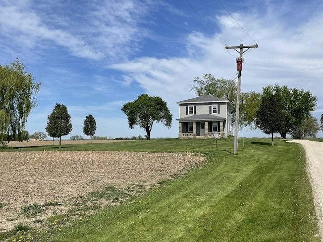 view of property's community with a lawn