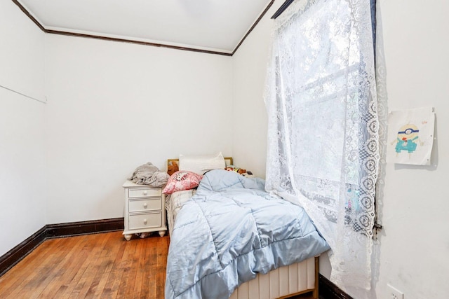 8548 S Manistee Ave, Chicago, IL 60617 - bedroom featuring ornamental molding, hardwood / wood-style flooring, and baseboards