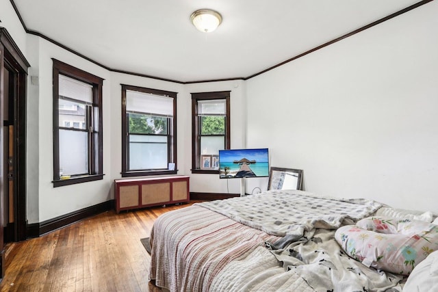 8548 S Manistee Ave, Chicago, IL 60617 - bedroom featuring ornamental molding, wood-type flooring, baseboards, and radiator