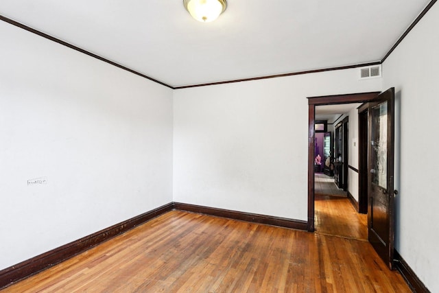 8548 S Manistee Ave, Chicago, IL 60617 - unfurnished room with ornamental molding, wood-type flooring, and baseboards