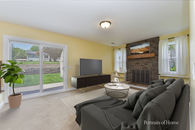 living area with carpet, baseboards, and a fireplace