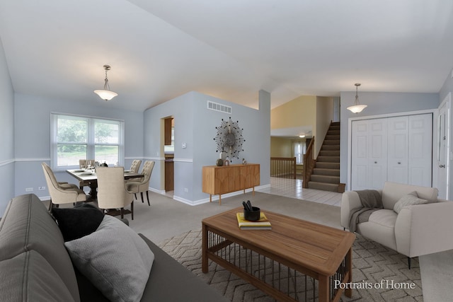 living area featuring vaulted ceiling, stairway, light carpet, and baseboards