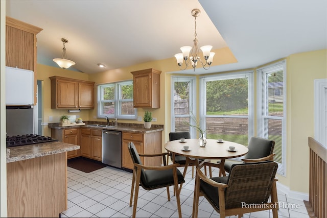 kitchen featuring stainless steel dishwasher, a sink, gas cooktop, a chandelier, and light tile patterned floors