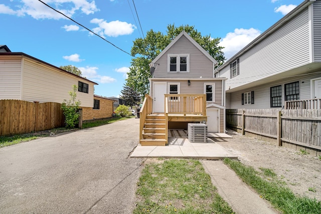 9331 S Turner Ave, Evergreen Park, IL 60805 - rear view of house featuring a fenced backyard, central AC, a patio, and a deck