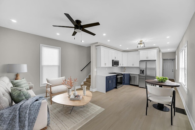 9331 S Turner Ave, Evergreen Park, IL 60805 - living area featuring healthy amount of natural light, baseboards, a ceiling fan, stairs, and recessed lighting