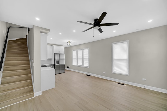 9331 S Turner Ave, Evergreen Park, IL 60805 - unfurnished living room featuring ceiling fan, baseboards, light wood-style floors, stairway, and recessed lighting