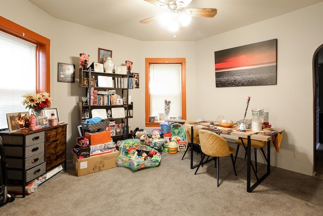 1002 N Drake Ave, Chicago, IL 60651 - dining space with carpet floors, ceiling fan, and arched walkways