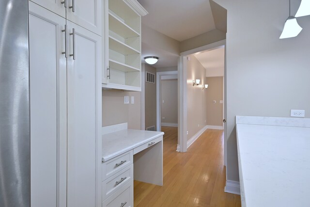5813 W Eastwood Ave, Chicago, IL 60630 - mudroom with light wood-type flooring and baseboards
