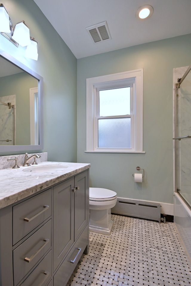 5813 W Eastwood Ave, Chicago, IL 60630 - bathroom with a baseboard radiator, toilet, vanity, and bath / shower combo with glass door