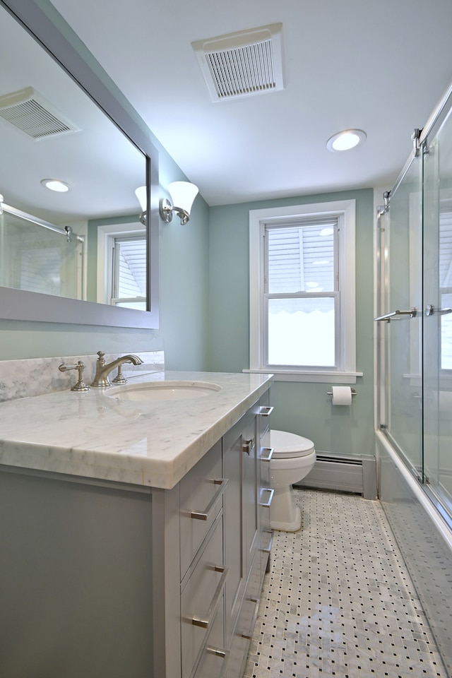 5813 W Eastwood Ave, Chicago, IL 60630 - bathroom featuring baseboard heating, toilet, vanity, combined bath / shower with glass door, and recessed lighting