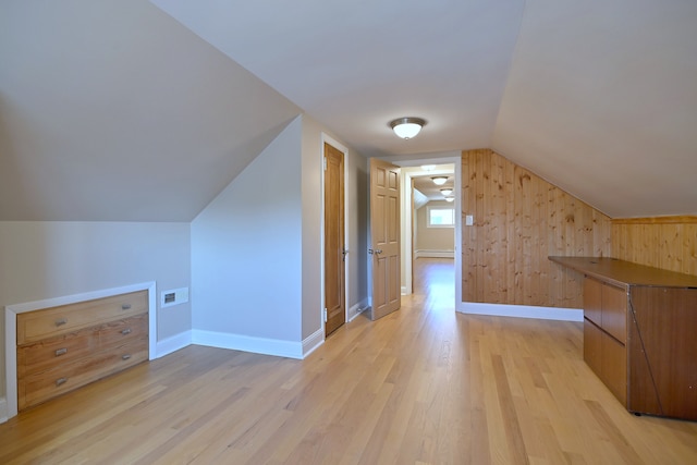 5813 W Eastwood Ave, Chicago, IL 60630 - bonus room featuring a baseboard heating unit, light wood finished floors, lofted ceiling, and baseboards