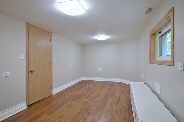 5813 W Eastwood Ave, Chicago, IL 60630 - empty room with wood finished floors and baseboards