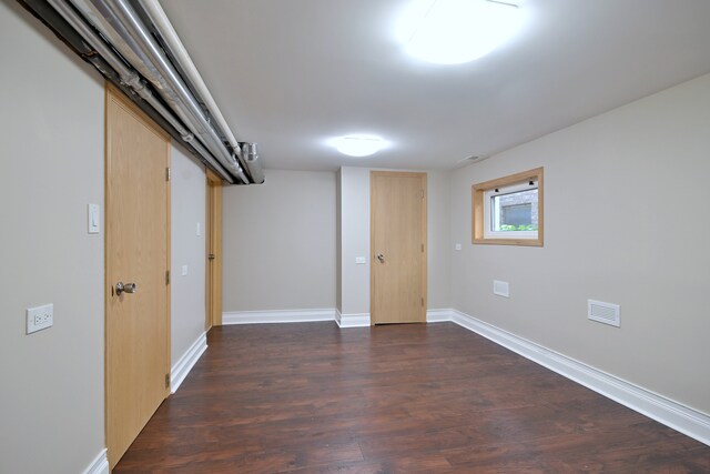 5813 W Eastwood Ave, Chicago, IL 60630 - below grade area with dark wood finished floors and baseboards