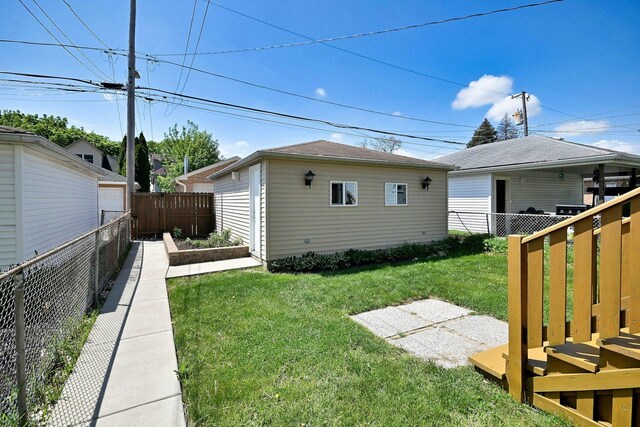 5813 W Eastwood Ave, Chicago, IL 60630 - back of house featuring a garden and an outdoor structure