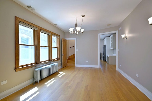 5813 W Eastwood Ave, Chicago, IL 60630 - unfurnished dining area with radiator, a chandelier, light wood-style flooring, and baseboards