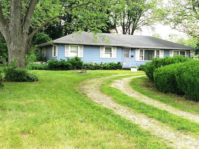 517 S Hebbard St, Joliet, IL 60433 - ranch-style house featuring a chimney and a front lawn
