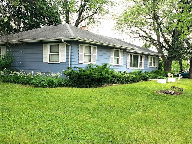 517 S Hebbard St, Joliet, IL 60433 - view of front of property featuring a front yard and a chimney