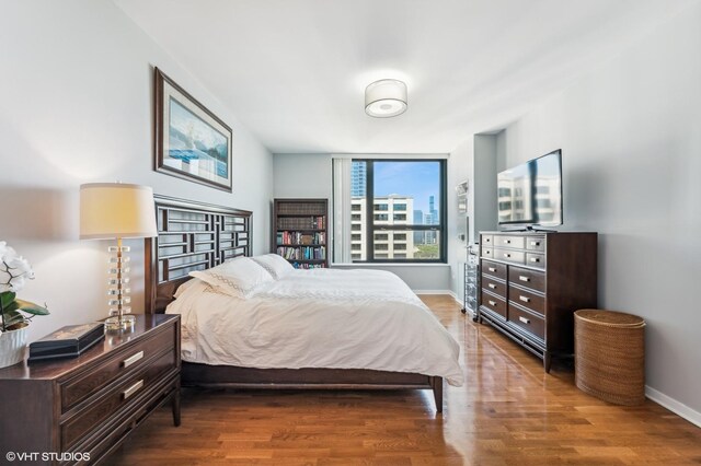 1160 S Michigan Ave Unit 3805, Chicago, IL 60605 - bedroom featuring wood finished floors and baseboards