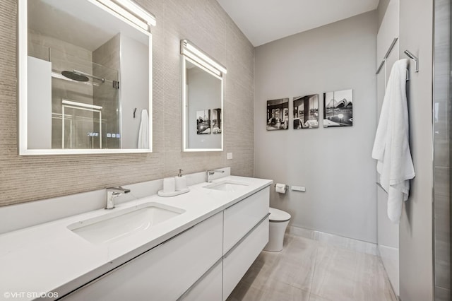 1160 S Michigan Ave Unit 3805, Chicago, IL 60605 - full bathroom featuring a shower stall, double vanity, toilet, tile walls, and baseboards