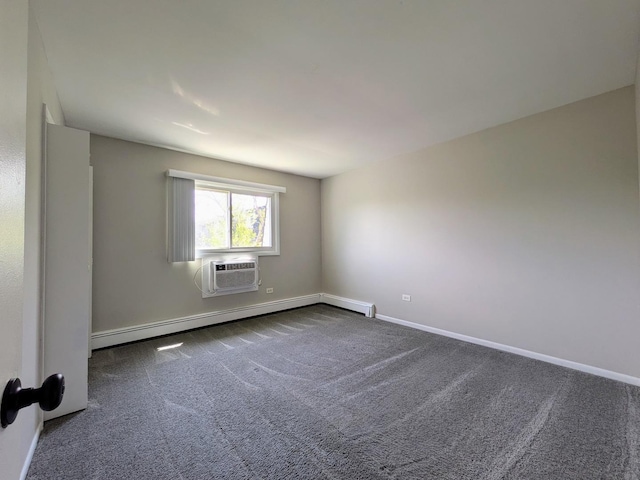 spare room with dark carpet, a wall unit AC, baseboards, and baseboard heating