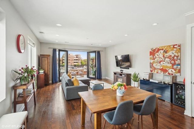 dining room with wood finished floors, recessed lighting, and baseboards