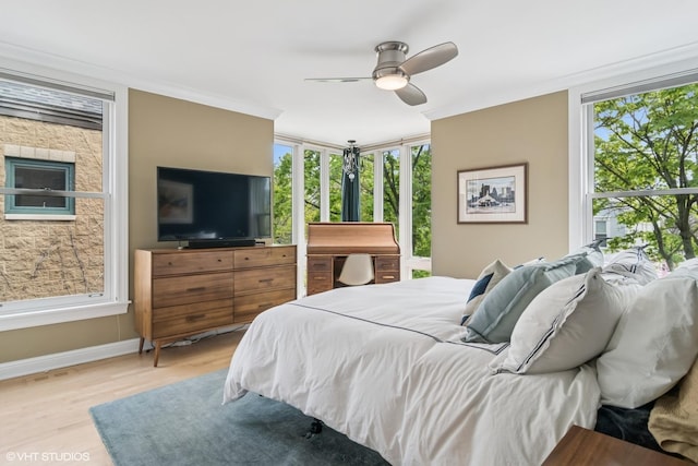 bedroom featuring wood finished floors, ceiling fan, and baseboards