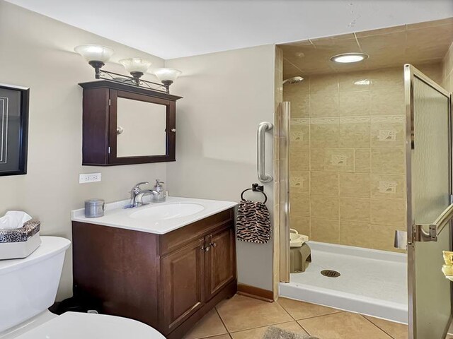 2919 193rd St, Lansing, IL 60438 - full bathroom featuring toilet, tile patterned floors, a stall shower, and vanity