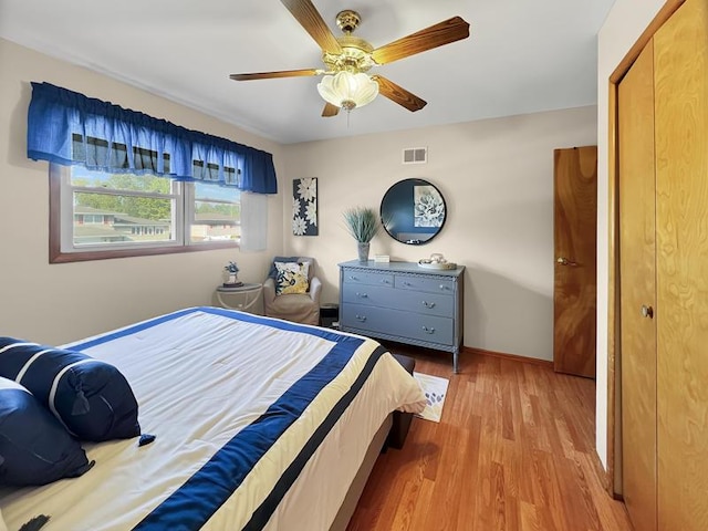 2919 193rd St, Lansing, IL 60438 - bedroom with wood finished floors, a ceiling fan, and baseboards