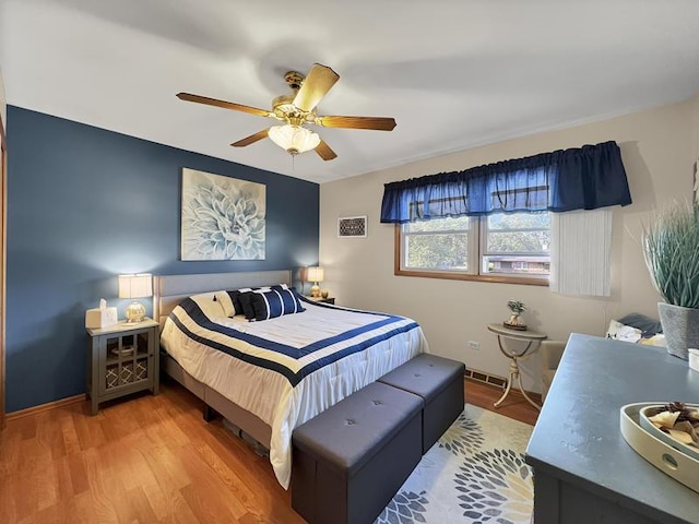 2919 193rd St, Lansing, IL 60438 - bedroom with wood finished floors, ceiling fan, and baseboards