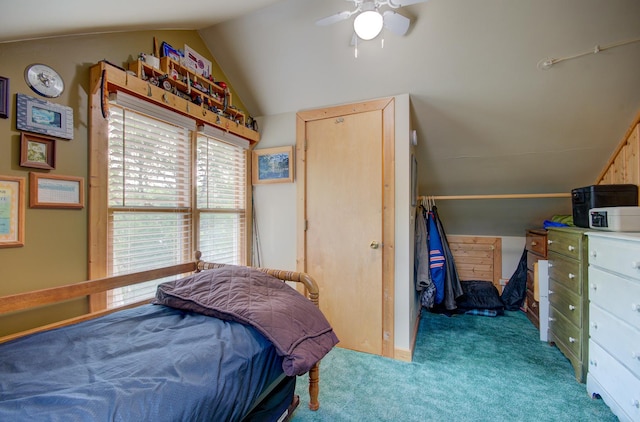 bedroom with vaulted ceiling, carpet flooring, and ceiling fan