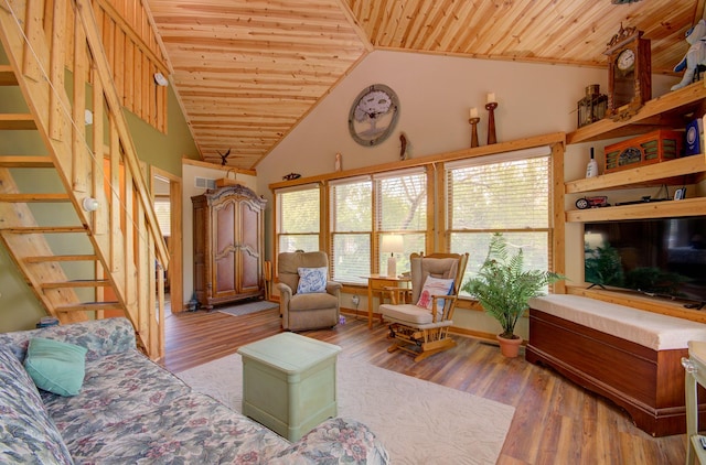 living area with wooden ceiling, wood finished floors, stairway, and vaulted ceiling