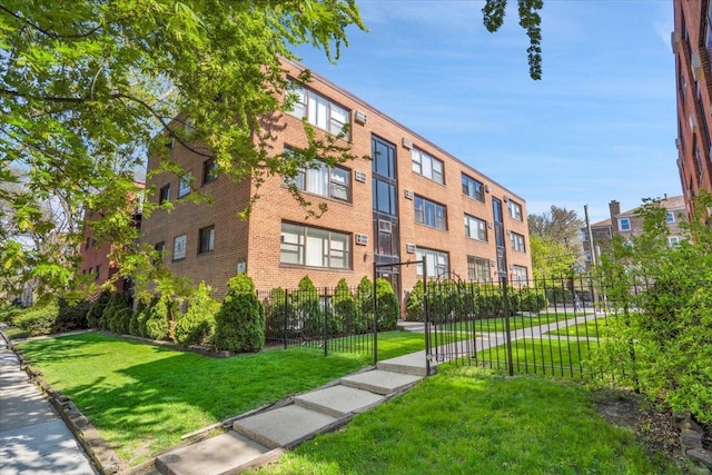 2907 W Summerdale Ave Unit D2, Chicago, IL 60625 - view of building exterior featuring fence
