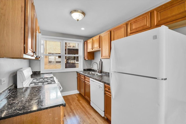 2907 W Summerdale Ave Unit D2, Chicago, IL 60625 - kitchen featuring white appliances, a sink, light wood-type flooring, baseboards, and brown cabinets