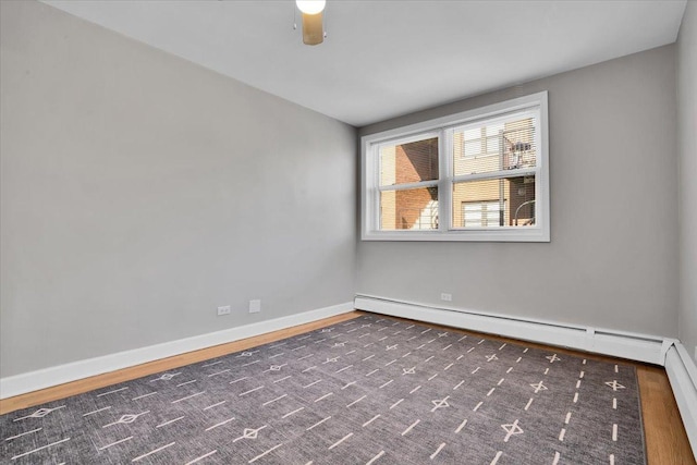 2907 W Summerdale Ave Unit D2, Chicago, IL 60625 - spare room featuring wood finished floors, baseboards, and a baseboard radiator