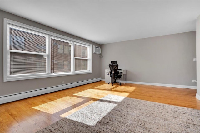 2907 W Summerdale Ave Unit D2, Chicago, IL 60625 - unfurnished room with a baseboard heating unit, wood finished floors, and an AC wall unit