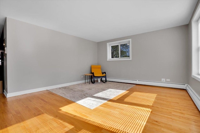 2907 W Summerdale Ave Unit D2, Chicago, IL 60625 - unfurnished room featuring wood finished floors, a baseboard heating unit, and baseboards