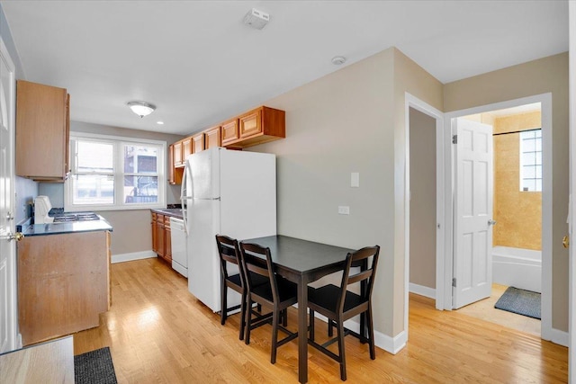 2907 W Summerdale Ave Unit D2, Chicago, IL 60625 - kitchen featuring white appliances, light wood-style floors, and baseboards